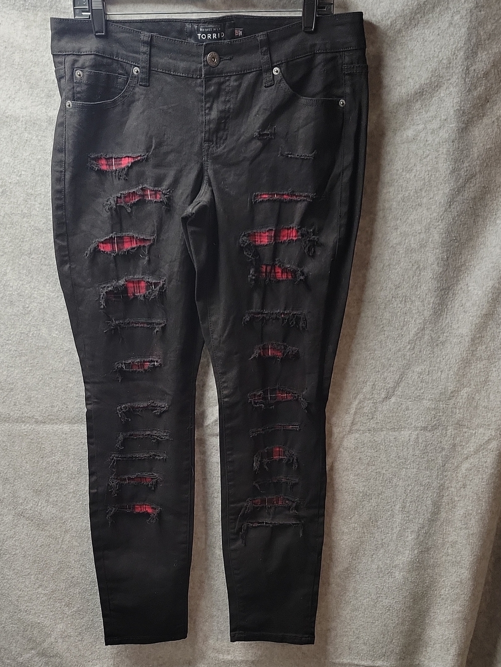 Torrid Black Skinny Jeans with Red Plaid Underlay